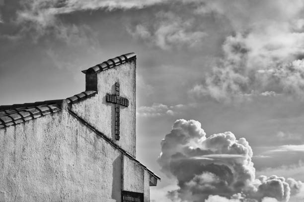 istock Church facade with a cross and dramatic sky. 2159630525