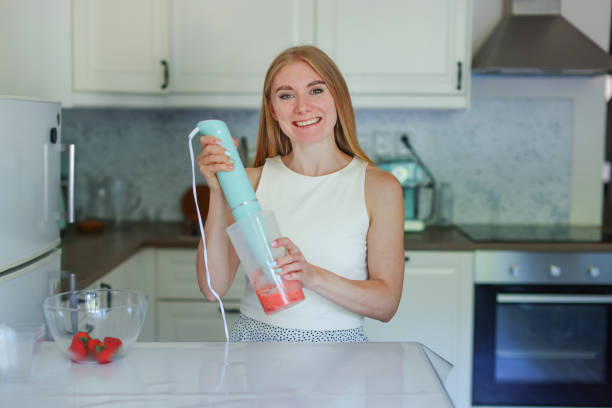 istock girl preparing dessert with strawberries 2159633592