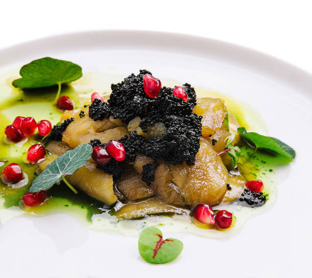 baked eggplant with black caviar on plate