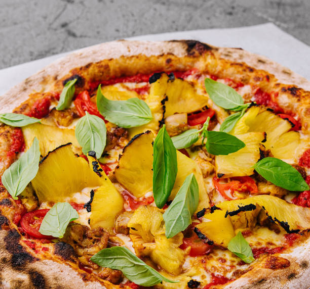 Fresh hawaiian pizza on wooden board