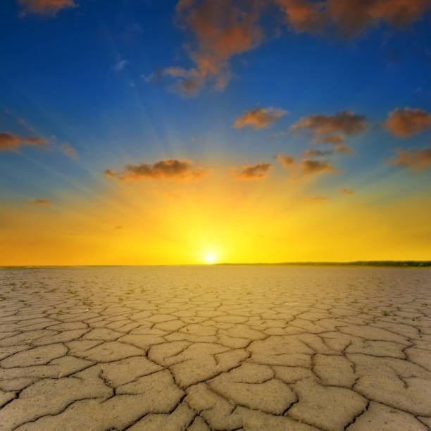 istock dry cracked earth at the dramatic sunset 2159634681