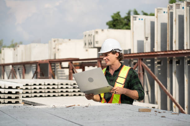istock Portrait happy caucasian engineer man use notebook computer working at precast cement outdoor factory 2159635179