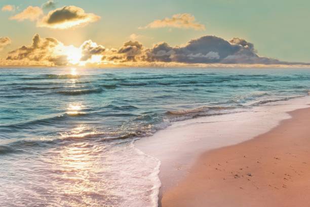 istock Colorful sunset viewed from the pink sea beach with soft waves 2159636007
