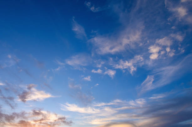 istock Pastel light cirrus clouds in the blue sky during dawn sunset sunrise, sky background 2159638640