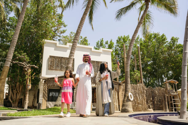 istock Smiling Saudi family exploring resort grounds 2159639633