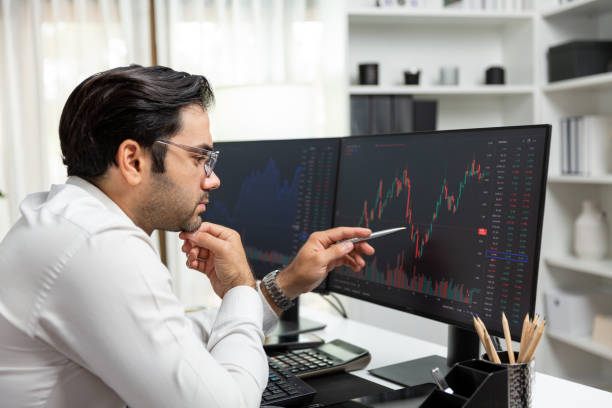 istock Trader analyzing in dynamic stock exchange investment screen on pc. Surmise. 2159639809