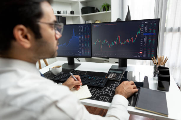 istock Trader analyzing in dynamic stock exchange investment screen on pc. Surmise. 2159639967