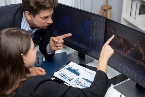 istock Two business traders discussing business statistic on report paper. Postulate. 2159640891