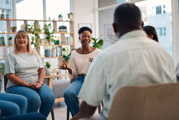 istock A diverse group of people is participating in a support group meeting. They are sharing their experiences and emotions in a supportive, friendly atmosphere. The image captures moments of connection and understanding. 2159641843
