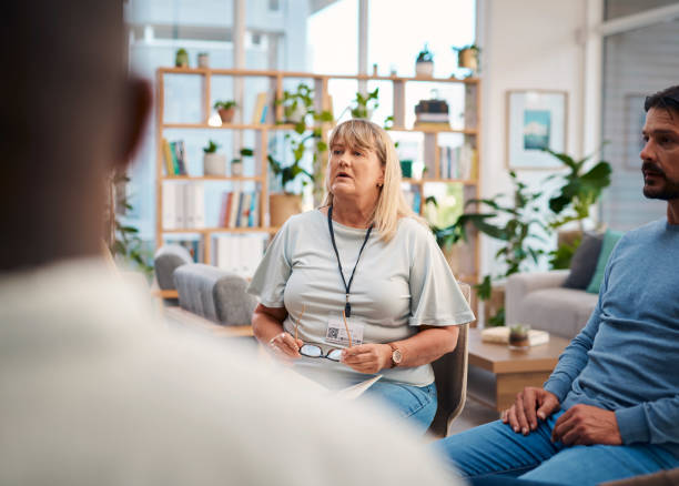 istock A diverse group of individuals participating in a support group meeting. The session takes place in a bright, welcoming room filled with plants and shelves in the background. Community, communication, mental health. 2159641898
