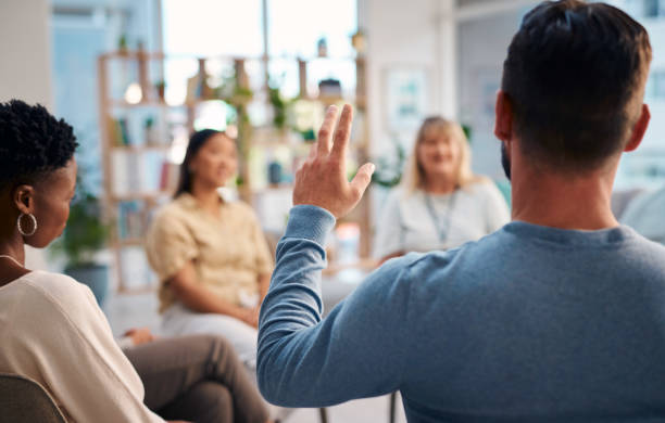 istock A diverse group of individuals engaging in a support group meeting, sharing feelings and experiences in an open and positive atmosphere. The image highlights connection, understanding, and community support. 2159641963