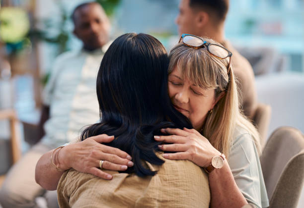 istock Diverse Group of People Embracing and Supporting Each Other in a Support Group 2159642010