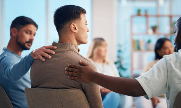 istock Diverse Group of People Attending a Support Group Session for Encouragement and Comfort 2159642028