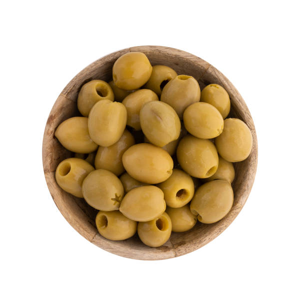istock green olives in wooden bowl isolated on white 2159643196