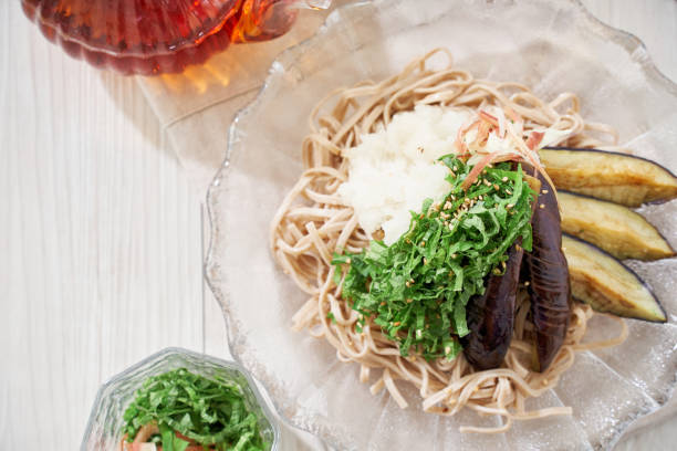 Cold soba noodles with fried eggplant, shiso leaves and grated radish