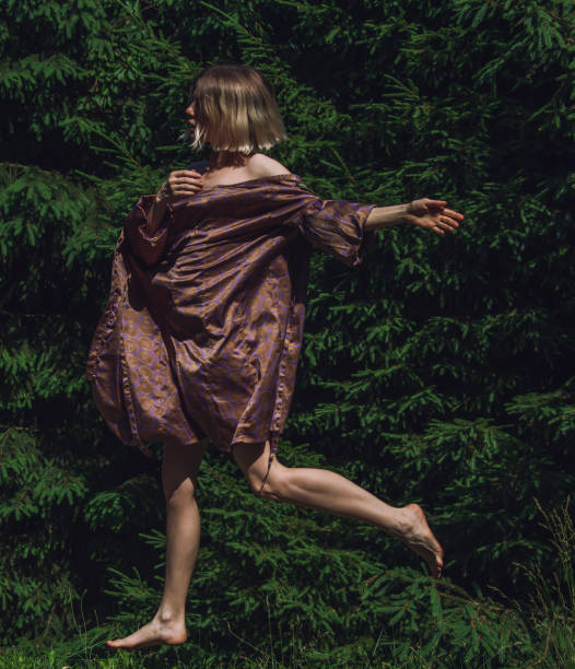 istock young beautiful woman in action at nature 2159647781