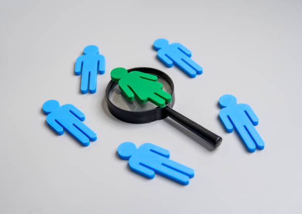 istock Woman use magnifying glass to find Mr. Right. 2159648981