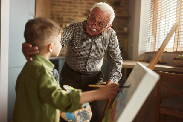 istock What are you painting grandson? 2159649880