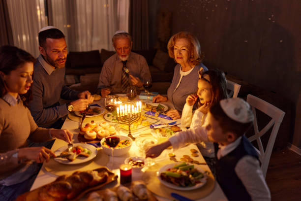 istock Happy extended family having dinner on Hanukkah. 2159653322