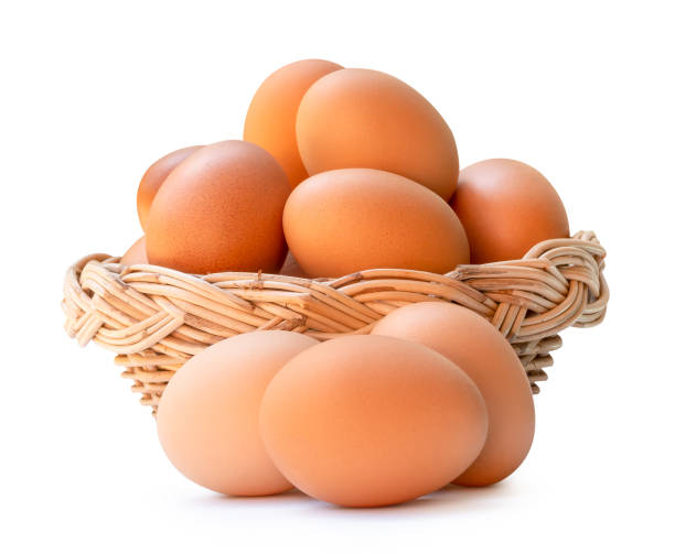 istock Front view of brown chicken eggs in stack in wicker basket isolated on white background with clipping path 2159653939