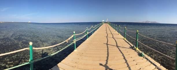 istock Rob and wood Seaside bridge with shadow 2159654479