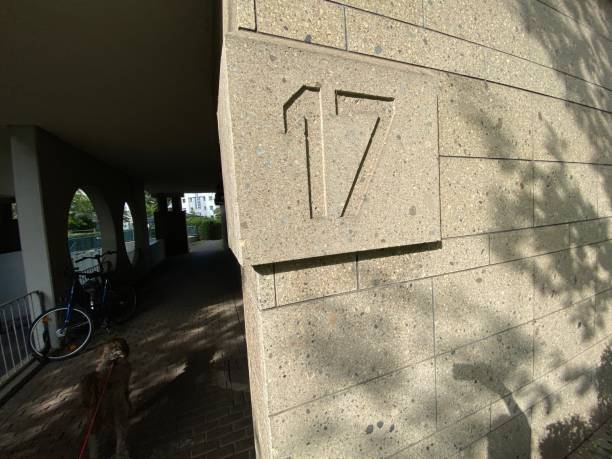 istock House number 17 carved in stone 2159654777