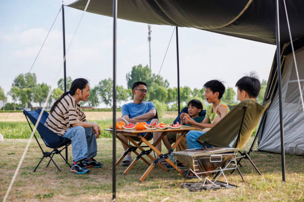 istock Young Asian parents and children camping 2159656503