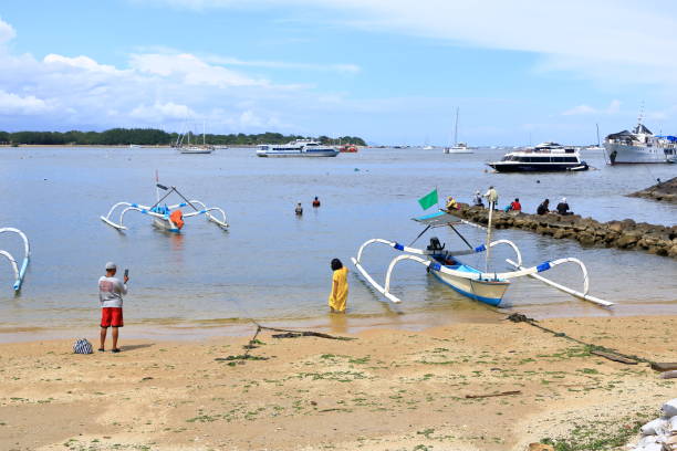 Serangan, Denpasar, Bali in Indonesia - February 09 2024: Boats parked at Serangan bay