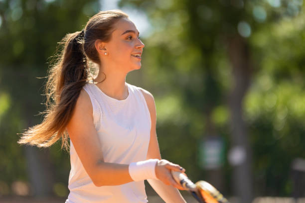 istock A woman is playing tennis and smiling 2159660767
