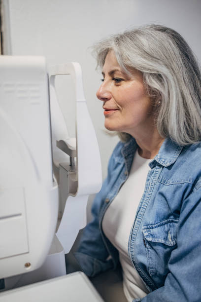 Elderly woman undergoing an eye examination at clinic