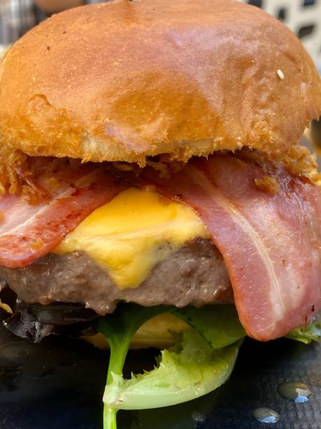 istock Bag tasty burger with bacon, cheese, and lettuce. 2159662553
