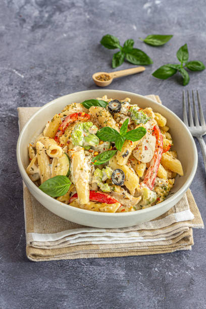 istock Creamy Penne Alfredo with Basil and Chilli Flakes Vertical Photo 2159663004