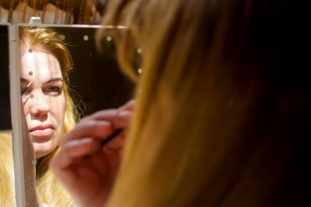 istock Woman looking in mirror. Copy space makeup mirror. Skincare routine mirror. Copy space 2159663998