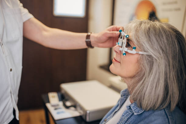 istock Optometrist examining a patient with medical device. 2159665684