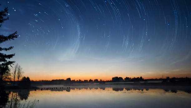 istock silver clouds shake the lake on a bright summer night 2159670191