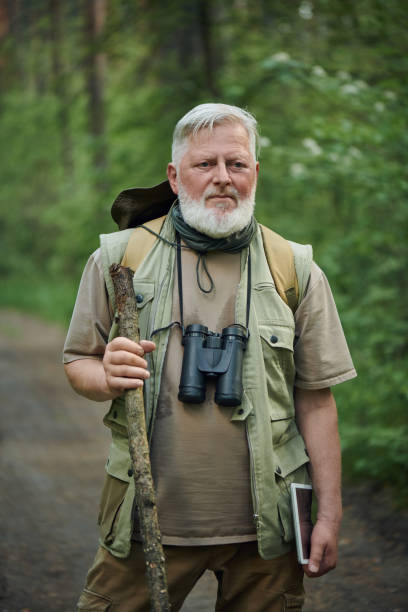 istock Serious Mature Naturalist Standing On Road 2159671819