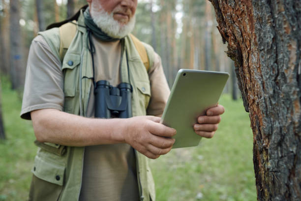 istock Man Taking Photo Of Tree Bark 2159671885
