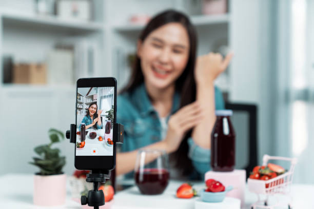istock Selective focus phone mixed strawberry and cherry juice drinks. Stratagem. 2159672008