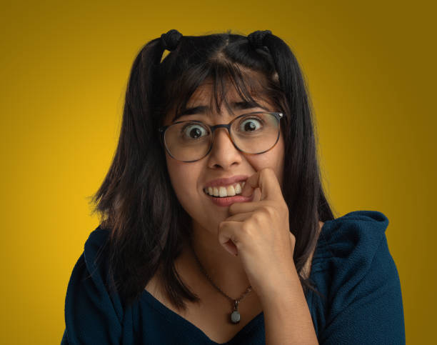 istock Portrait of anxious woman biting fingernails 2159676752