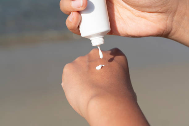 istock Woman hand apply sunscreen 2159676999