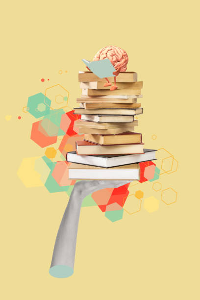 A hand holding books with a brain reading on the top on a colored background with copy space