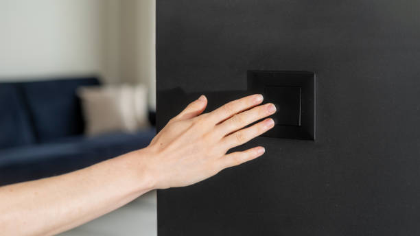 istock Cropped shot of woman hand pressing on light switch 2159682017