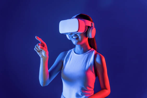 istock Elegant female connect metaverse use finger point virtual object. Hallucination. 2159682863
