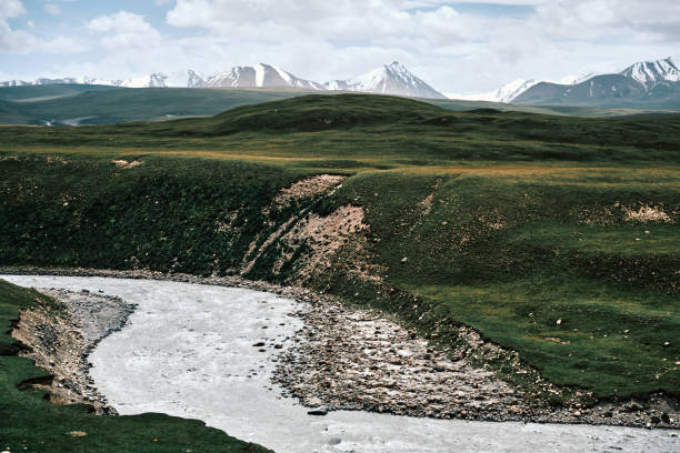 istock Green lush river valley among mountain peaks 2159684071