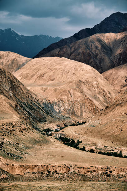 istock Vast dry mountain landscape bisected by a powerful river 2159684339