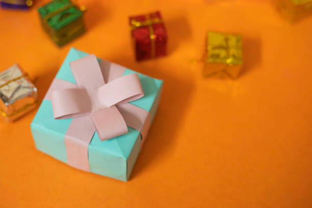 folded and cut green paper into cute bow design