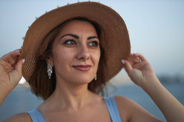 Summer time, shining sun concept. Sunny portrait of nice woman. Attractive lady has amazing necklace.