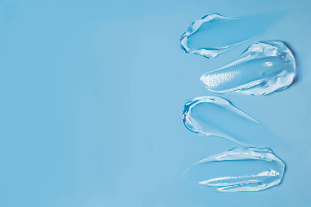 istock Gel smears cosmetic texture on blue background with space for text 2159688469