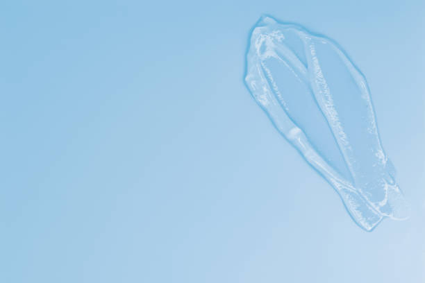 istock Gel smears cosmetic texture on blue background with space for text 2159689303