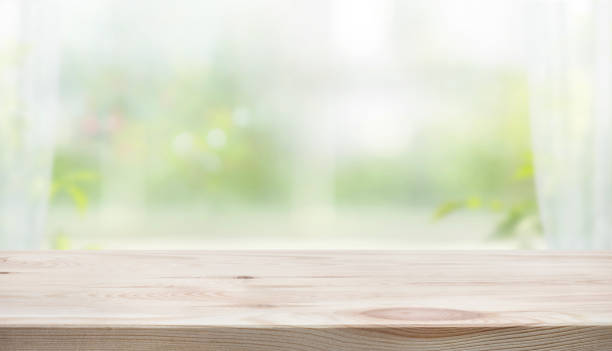 istock Wood table counter on blur curtain window in fresh morning background.copy space 2159691260
